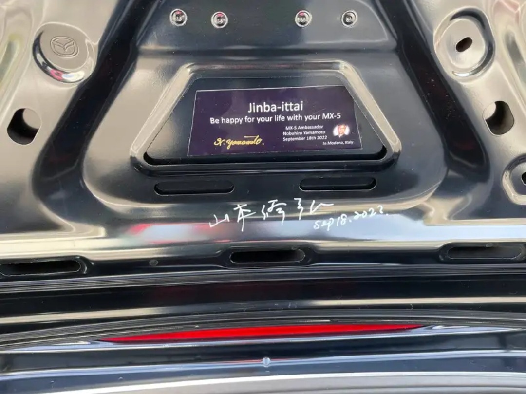 Yamamoto-san's signature and Jinba-ittai plaque on the trunk lid of the MX-5 Yamamoto Signature Edition